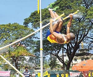 Vishnu Unni, of St George's HSS, Kothamangalam, falling after his pole broke during the  State School Athletics Championship in Kochi | Rajeev Prasad