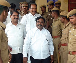 in the net: DMK ward secretary Lenin at the Kolathur  police station on Friday | Express Photo