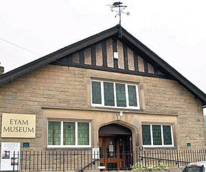 Eyam Museum with the ‘plague’ rat on the weather vane. The Eyam village museum is a popular and major tourist attraction for visitors to Derbyshire