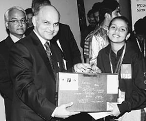 K K Sharma, IAS, Advisor to Administrator UT  Chandigarh presenting  the award to an Intel IRIS 2011 winner.