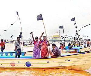 UP IN ARMS: Fishermen from the coastal belt protesting off the Koodankulam nuclear power plant with black flags on their boats on Monday | EPS