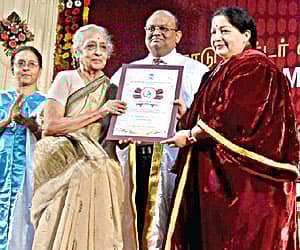 Chief Minister J Jayalalithaa presenting a lifetime achievement award to Cancer Institute founder Dr V Shantha during a convocation in Chennai.