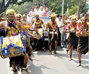 A procession of folk artistes accompanies the vehicle in which Jnanpith awardee  Chandrashekar Kambar | Express Photo
