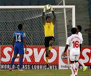Indian goalkeeper Karanjit Singh jumps to save a goal against Sri Lanka at the SAFF Championship 2011 in New Delhi. PTI