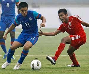Sunil Chhetri, left, dribbles past Maldive's Shafiu Ahmed during their semi-final soccer match of the SAFF Championship 2011 in New Delhi. AP