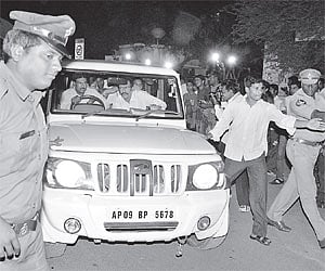 Police make way for the vehicle carrying senior IAS officer Y Sri Lakshmi after she was produced before Nampally court in Hyderabad on Monday.