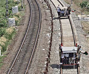 Railway officials conducting safety check along the newly-constructed second track along Ernakulam.