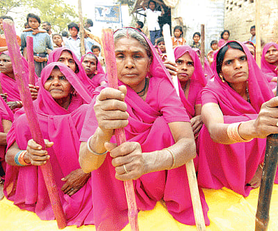 Clockwise from top: women gathered for a Gulabi gang meeting in Banda; Sampath Pal, the feisty  leader and founder of the Gulabi Gang, telling people