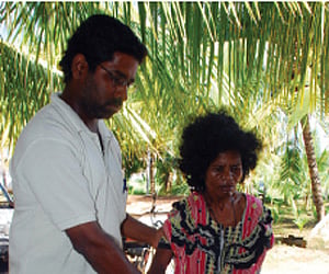 Cochin Port Trust chairman Paul Antony, port employees and crew with the new reach stacker, that was commissioned on Saturday | Express Photo