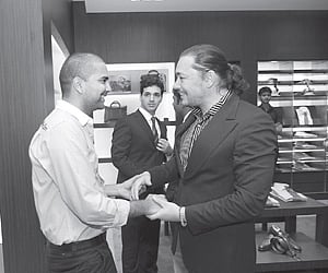 Harsha Reddy and Kelly Dorji greet each other at the fashion event.