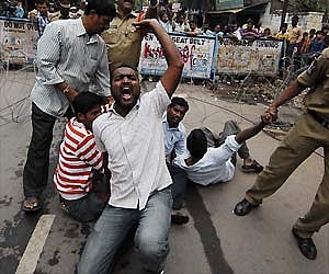 Police arresting activists of OUJAC who tried to force their way into the Minister’s Quarters at Banjara Hills protesting the AP Formation Day fete.