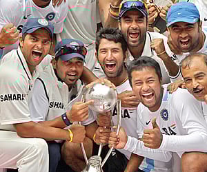 CHAMPION PERFORMERS: India celebrate after winning the two-Test series 2-0 against Austraila and retaining the Border-Gavaskar Trophy in Bangalore on