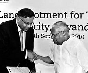 Chief Minister V S Achuthanandan handing over the government order TCS chief executive officer N Chandrasekaran. (ENS)