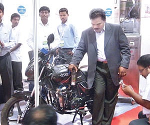 Promoters of HHO Generator system giving a demonstration at Renewable Asia 2012 expo in Bangalore on Sunday