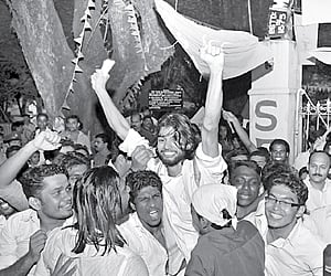 Students of Maharaja's College lift Jino John who won the chairman's post on the KSU ticket.