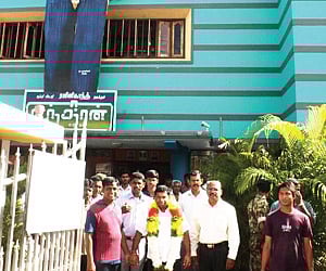 GRAND OPENING: A huge cutout of Rajnikanth put up at the entrance of a theatre at Batticaloa where eastern province CM S Chandrakanthan inaugurated th