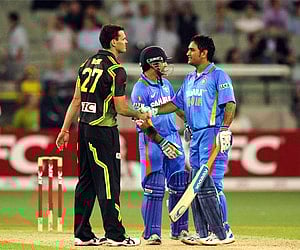 MS Dhoni shakes hands with Australia's Clint McKay after India win by 8 wickets during  the Twenty20 match at MCG in Melbourne on Friday. (AP)