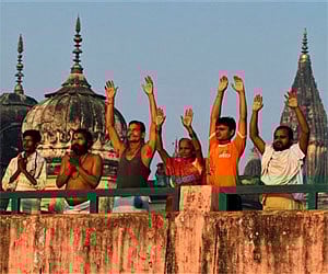 Hindu devotees pray after bathing at the Rama Ghat on the bank of Saryu River in Ayodhya. AP