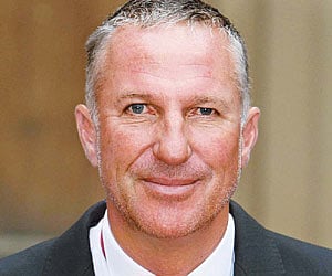 Ian Botham saved from crocodile attack by his former rival Merv Hughes