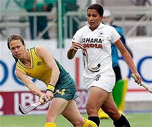 Followed by India's Rani Rampal, Australia's Nicole Arrold, left, hits the ball during a 2010 Women's Hockey World Cup match in Argentina. AP