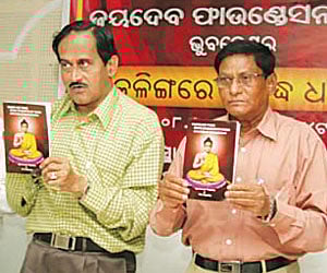 State Election Commissioner Ajit Tripathy (Left)  releasing a book ‘Where are those stone epigraphs on Ashoka located at Kapileswar?'  (Express Photo)