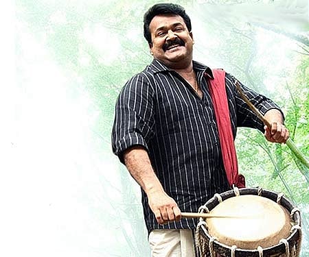 The poster of 'Snehaveedu'.