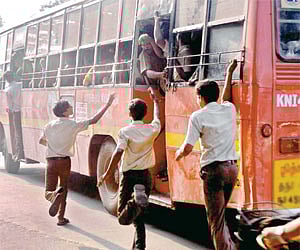 Students rush to catch a bus which skips a  stop | P JAWAHAR