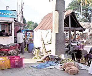 Illegal entry: Several petty shops have opened on the temple premises in Bahour| Express.