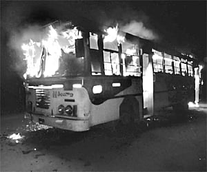 An RTC bus in flames after two youths set it ablaze near German guest house on the outskirts of Vemulawada on Sunday evening. | Express Photo