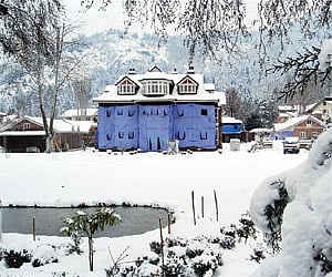 A heritage building covered with snow following a spell of heavy snowfall in Srinagar on Monday | PTI