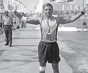 Sunil Menon celebrates after finishing the Half Iron Man event in Colombo, Sri Lanka.