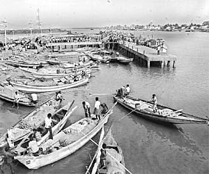 Fishermen venture out in the waters at Bairavapalem in Yanam on Sunday, as calm returned to the picturesque town after two days.