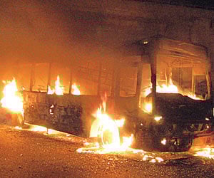 An Aero Express bus in flames at Kishenguda in Hyderabad on Monday.