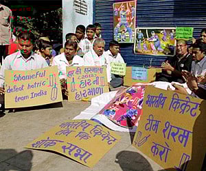 Indian cricket fans hold placards during a protest in Ahmadabad on Saturday after Indian team lost four test match series against Australia. (AP)