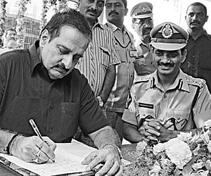 Director-general of police V Dinesh Reddy signing in a book after inaugurating a sub-control room at Benz Circle in Vijayawada on Friday.