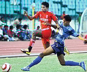 Players of Chennai Customs and Chennai FC battle for the ball in the Senior Division League on Thursday