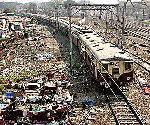 Jhuggies encroaching on railway land close to the tracks are growing