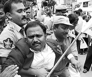 Police taking a lawyer into custody in Warangal on Tuesday.