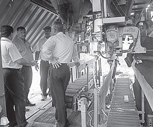 Cochin Port Trust Chairman Paul Antony along with other senior officials inspecting the automatic fertiliser bagging unit