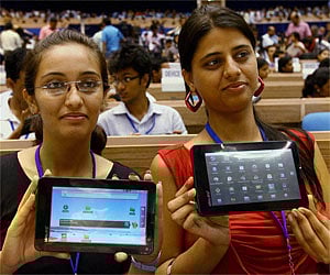 Students proudly show their "Akash" the locally-made touch screen computer costing 2,200 rupees. (Photo: PTI)