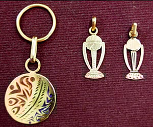 Goldsmith N Sathyanarayanachar (right) in Chitradurga has designed mini replicas in gold of ICC World Cup 2011 and a key chain with the ICC logo