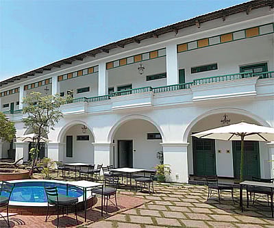 Cheerful interiors of Malabar House (left); the courtyard of the Grand Residencia (below)