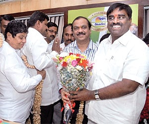 Somashekhara Reddy being greeted after his renomination as KMF president in Bangalore on Tuesday | Express Photo
