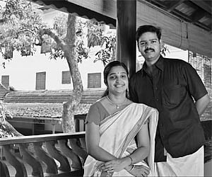 Praveen Maranat and wife (above), the Maranat Mana in twilight (top), the stately Puthiya Kovilakam . (EPS)