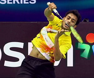 India's Sourabh Verma plays a shot against Kenichi Tago of Japan in the men's singles round badminton match of India Open Super Series 2011. (PTI)