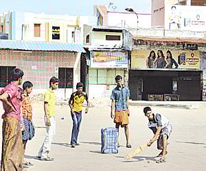 While Paramakudi town observed a complete shutdown, these boys utilised the deserted bus stand to play cricket on Monday | Express