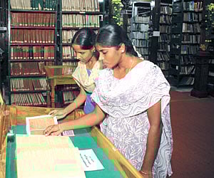 Visitors glance through rare books put on display at Connemara Public Library