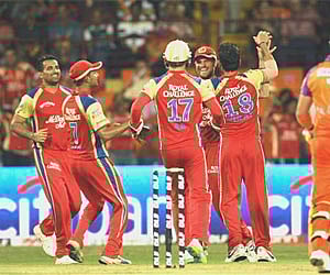 RCB’s Dirk Nannes and Zaheer Khan celebrate after taking the wicket of Kochi Tuskers Kerala’s Brendon McCullum in Kochi, April 9, 2011. (AP)