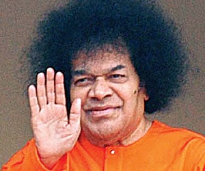 Farewell: Sathya Sai Baba who has followers in over 100 countries blesses his devotees in this file photo