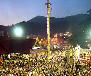 Pilgrims witnessing Makarajyothi from the Sopanam of the Lord Ayyappa temple - Express file Photo